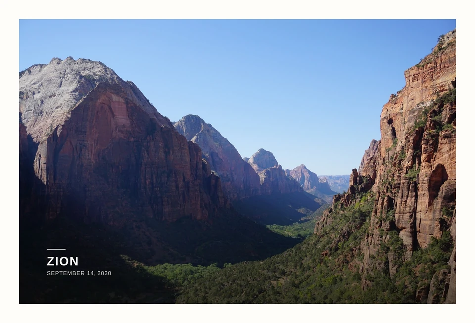 A photograph of a green valley between towering canyon walls. Zion, September 14, 2020.